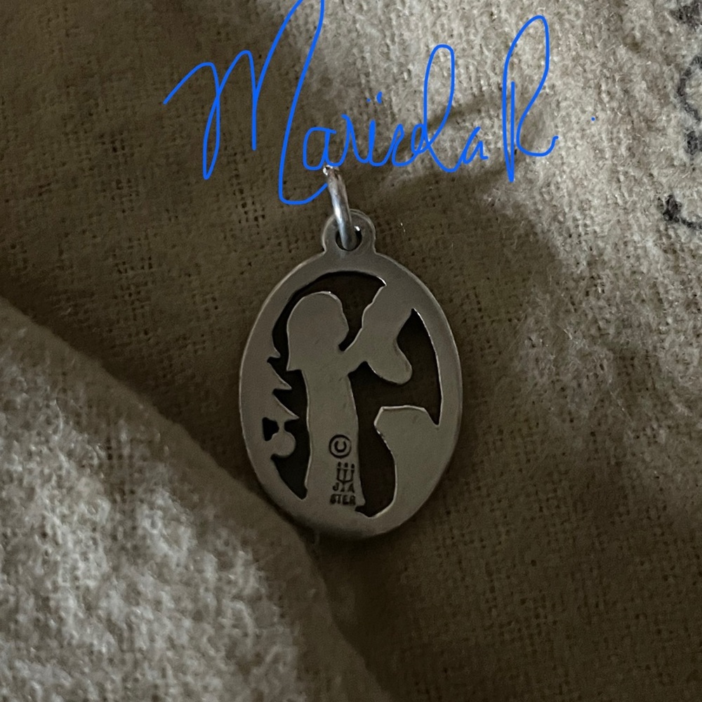 Retired James Avery girl charm.